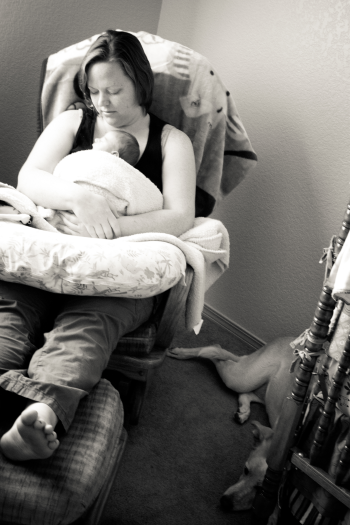 Mom rocking infant in glider rocker after nursing, photo Courtesy of Red Blossom Photography