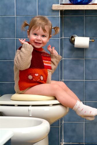 happy girl on a potty seat