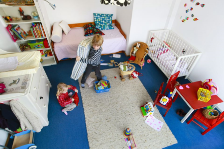 Toy Storage Ideas - Children helping clean up their room