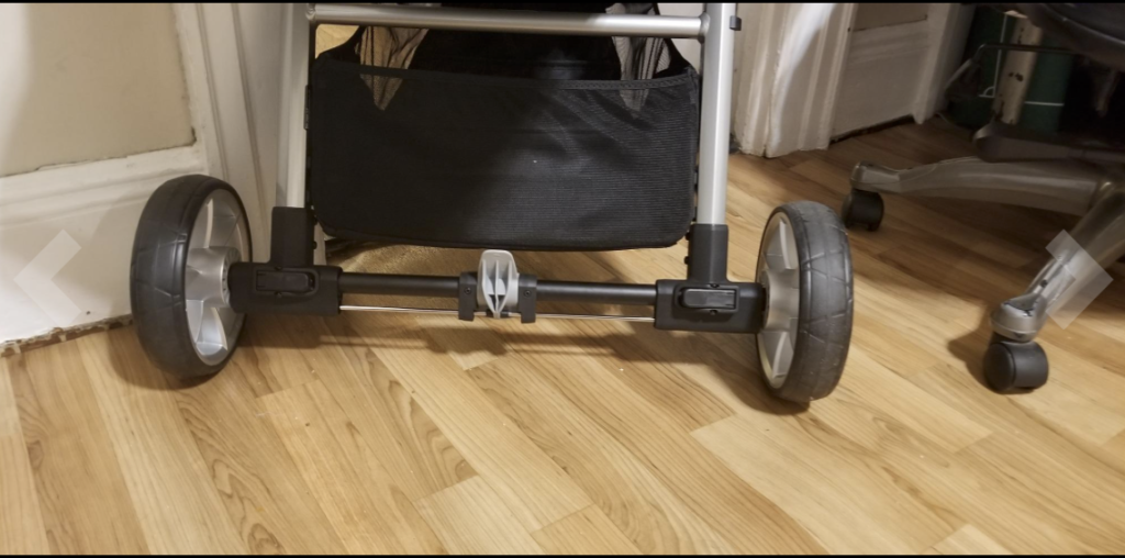Baby Jogger City Mini 2 review: Showing width of the stroller in space between back wheels and frame.