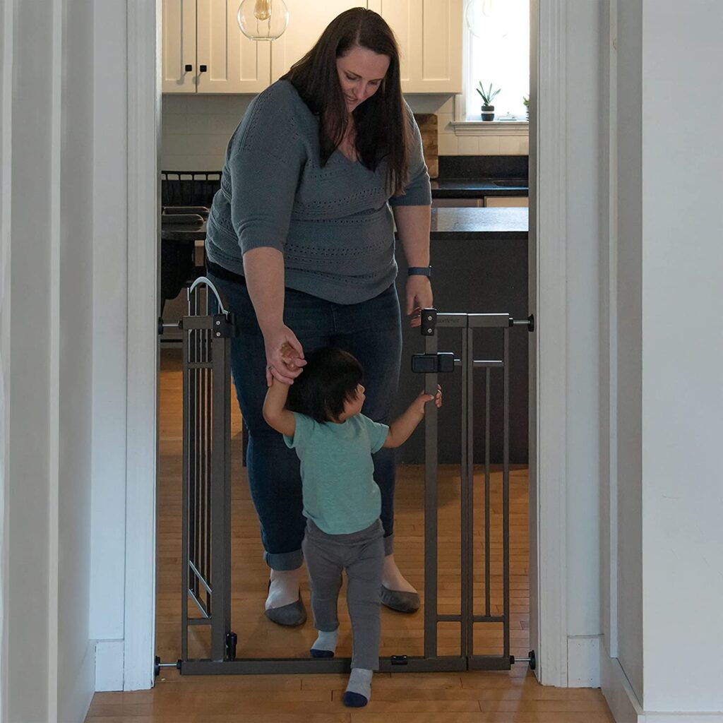 Baby walking through gate