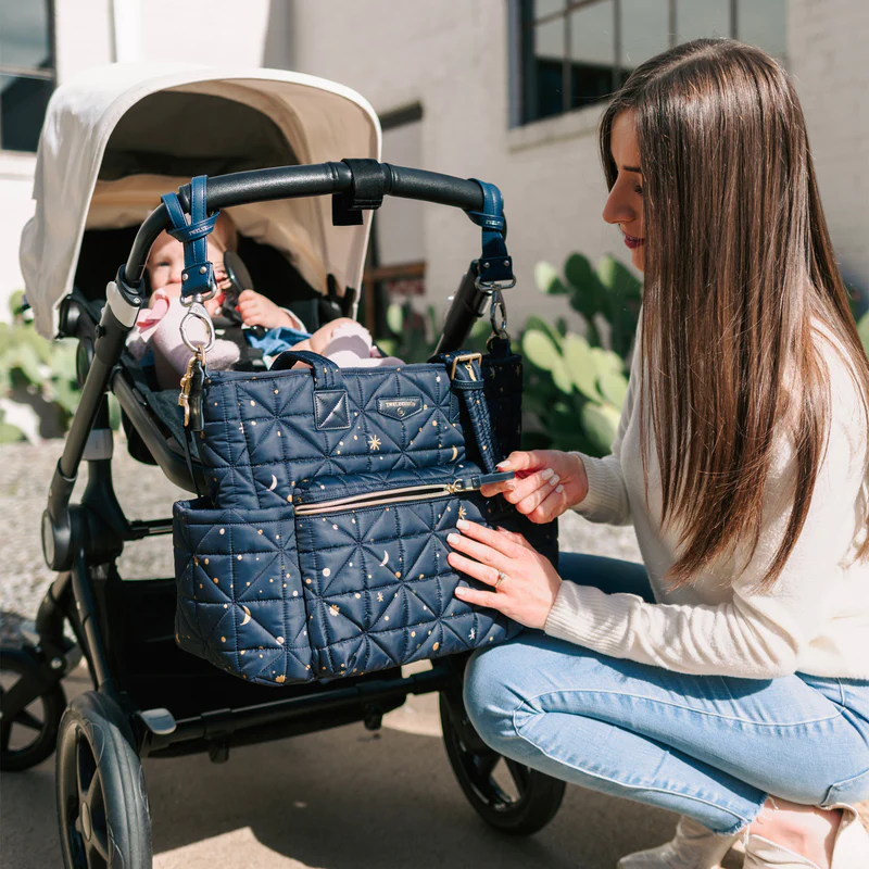 twelvelittle diaper tote hanging on stroller